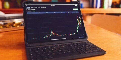 Laptop with Financial Chart Displayed